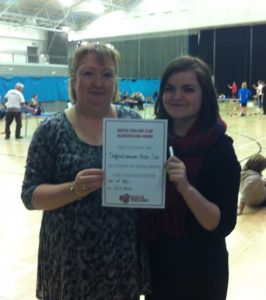 Karen Codling and Charlotte Faulkner receive the award on behalf of the Sheffield Smashers club