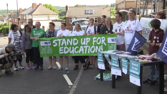 Dozens march to highlight education cuts