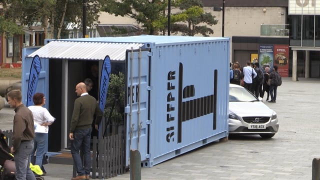 Affordable housing in a shipping container on display